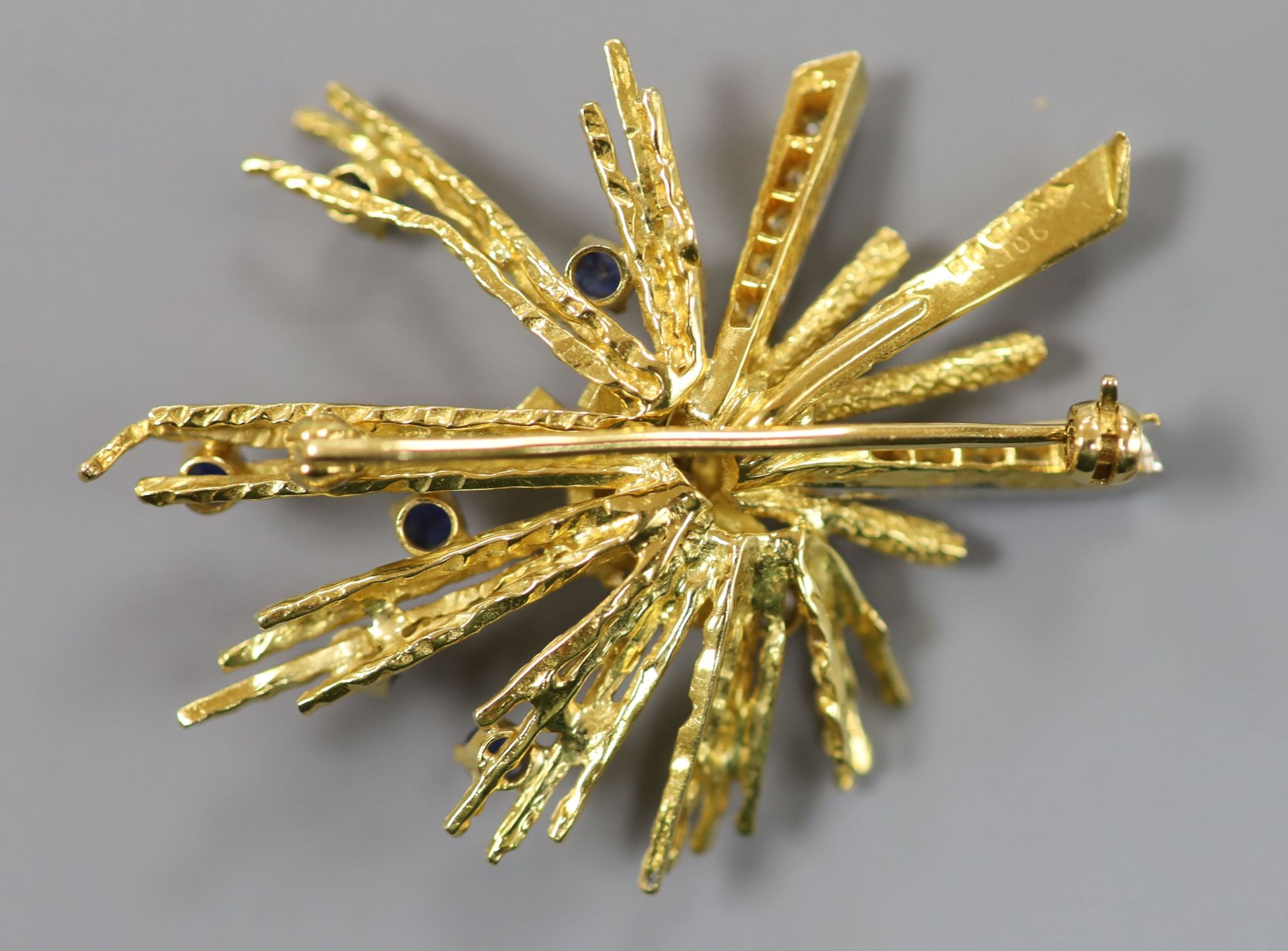 A late 1960s 18ct gold, sapphire and diamond set modernist spray brooch, 48mm, gross 16.5 grams,